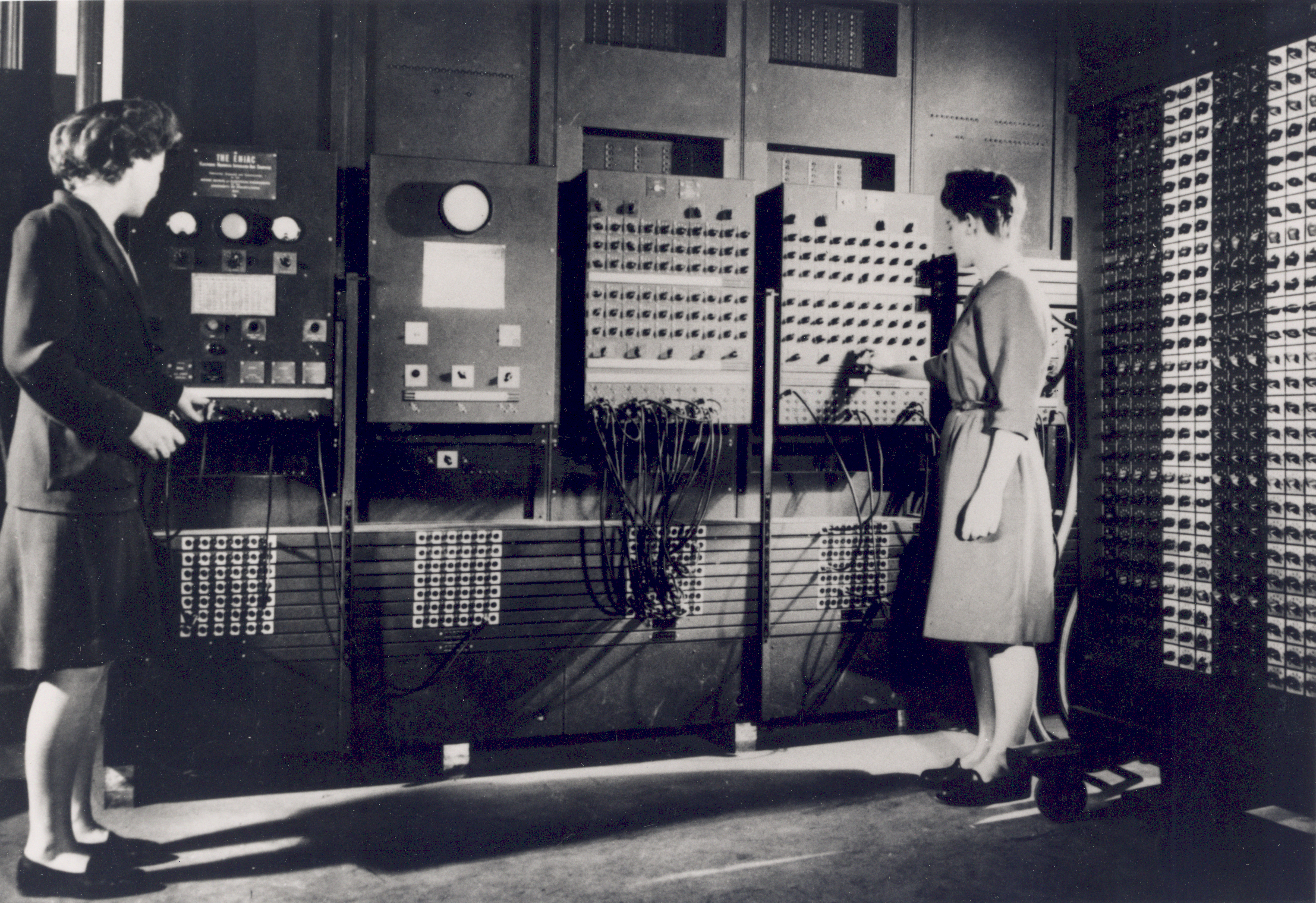 Two programmers operating ENIAC.